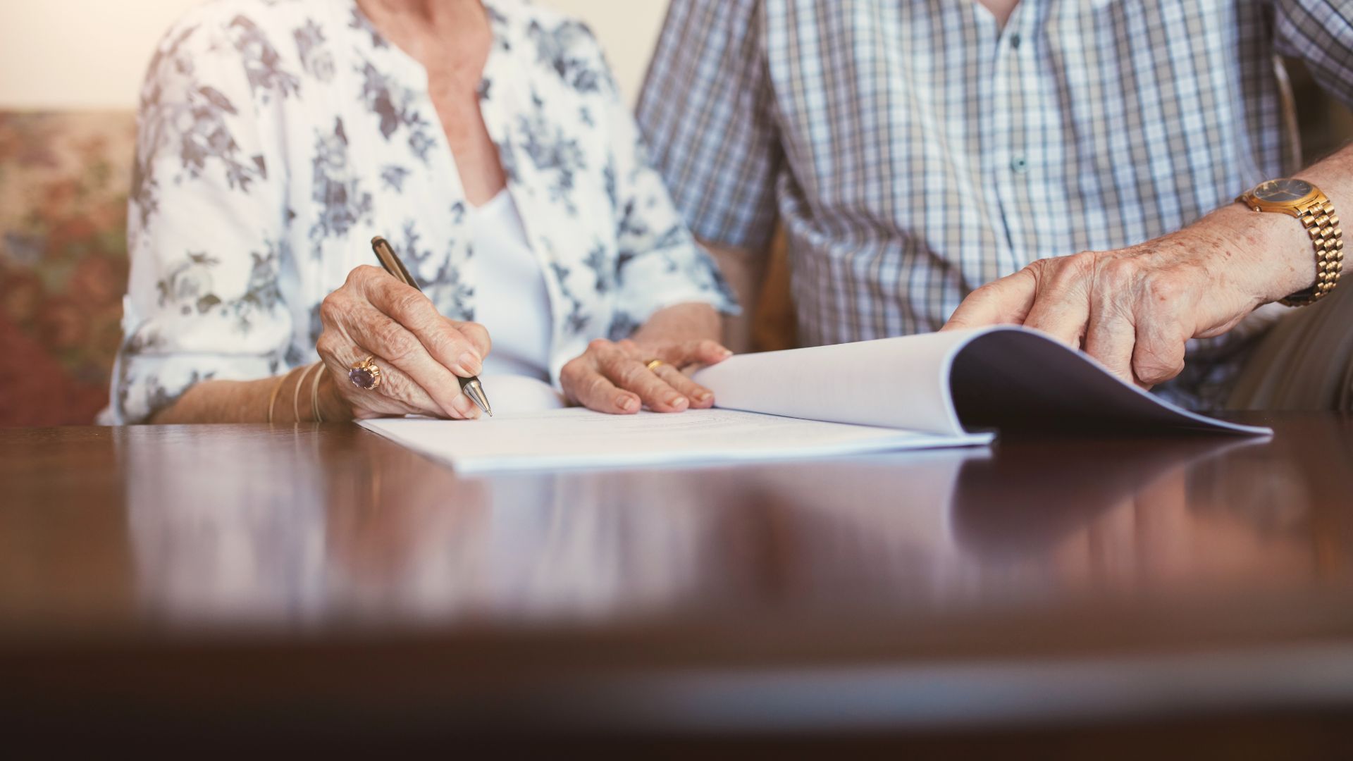 Senior reviewing estate planning documents with attorney to ensure mental capacity