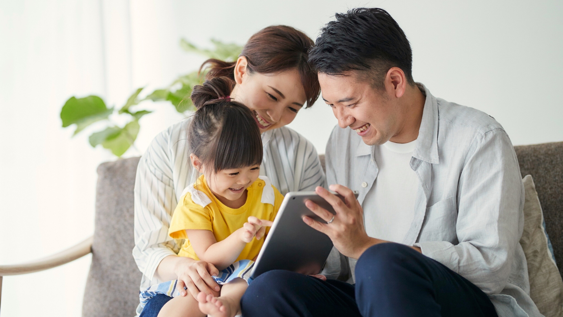 Working parents spending quality time with children while balancing careers and family life.