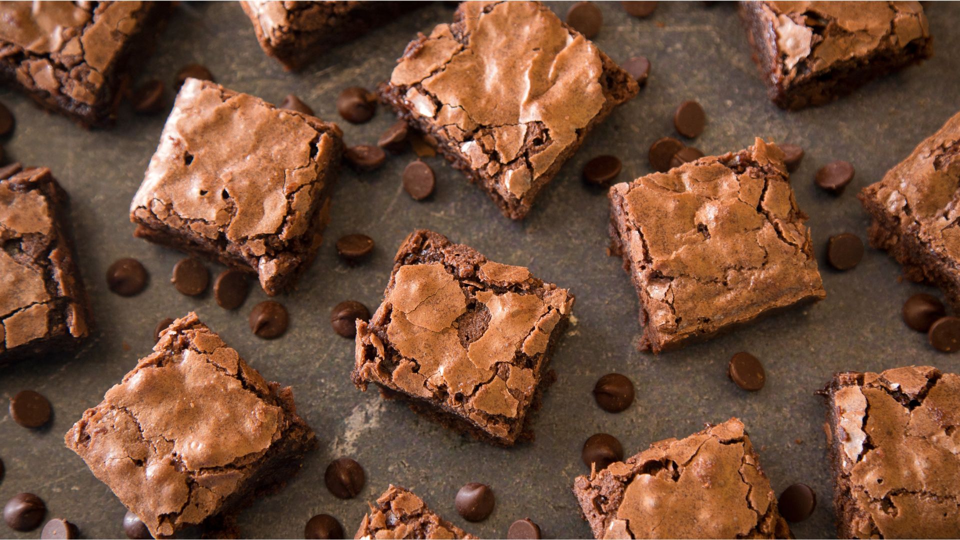 Fresh chocolate brownies on a plate, highlighting the warm and nostalgic appeal of this classic dessert.