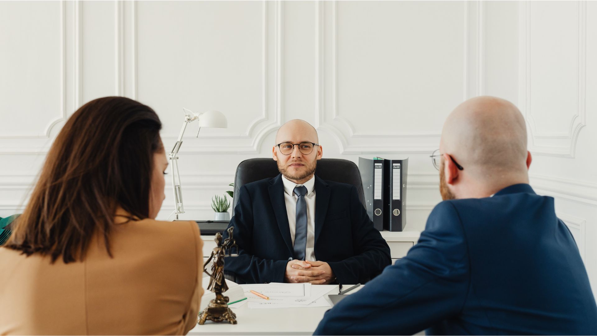 Attorney explaining trust laws to a family in Madison, highlighting Wisconsin-specific trust laws and local benefits.
