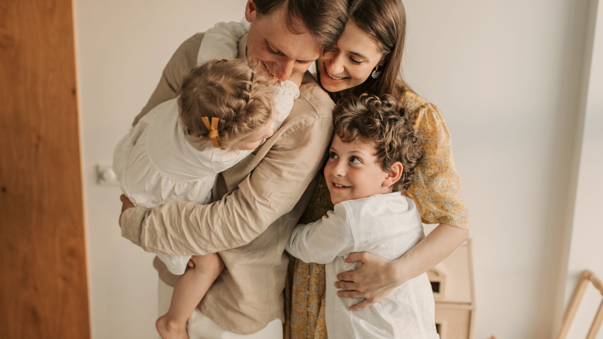 Family hugging and sharing warmth, symbolizing the importance of human connection and emotional support.