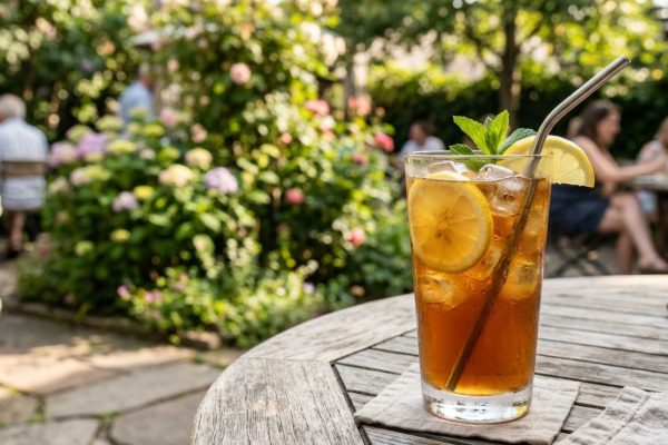 Refreshing glass of iced tea served outdoors on a summer day celebrating National Iced Tea Day